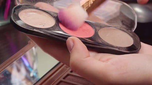 Female Hands Applying Makeup Blush From Face Cosmetic Palette Close Up