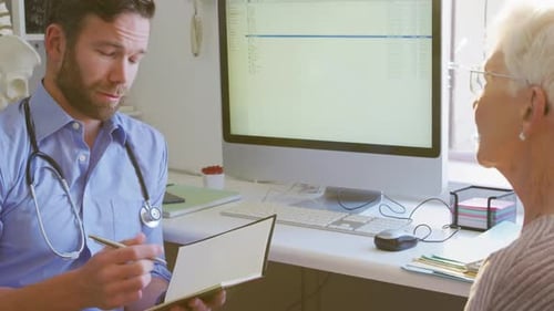 Doctor and Patient Consultation in Modern Medical Office