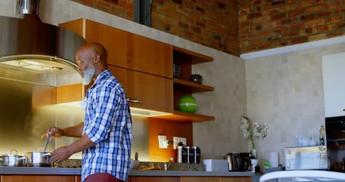 Man Cooking in Modern Kitchen