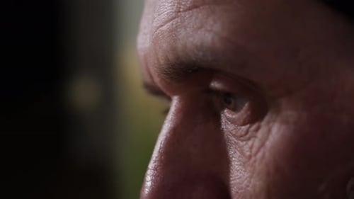 Closeup of the Eye of a Thoughtful Adult Experienced Master Engaged in His Work