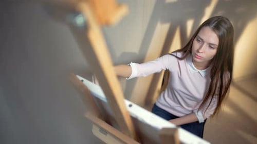 Creative Contemporary Beautiful Painter Working in Art Workshop