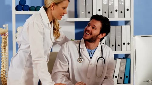 Medical Professionals Consulting Together in Office
