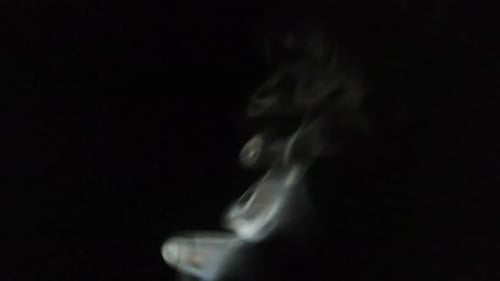 Abstract Smoke Swirls on a Dark Background
