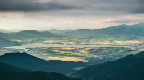 Scenic Landscape of Mountains, Lake and Rolling Hills