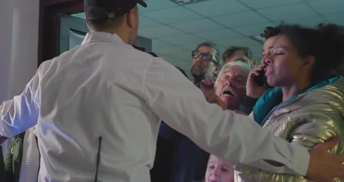 Security Guard Trying To Hold Crazy Crowd in Shop Entrance