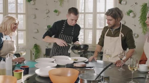 Group of Friends Cooking and Plating Food