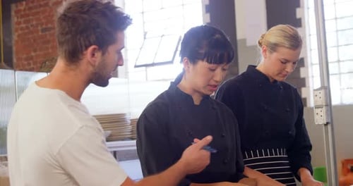 Chefs Working in a Restaurant Kitchen