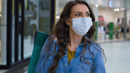 Video of young woman in shopping mall during pandemic. Shot with RED helium camera in 8K.