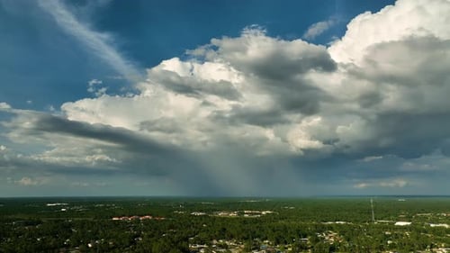 Landscape of Dark Ominous Clouds Forming on Stormy Sky Before Heavy Thunderstorm Over Rural Town