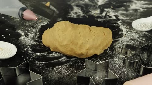 Hands Kneading Cookie Dough on Table