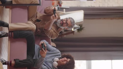 Adult and Young Adult Play Video Games Together