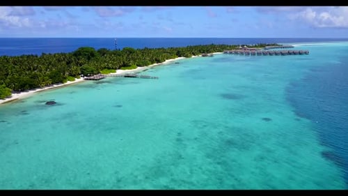 Aerial flying over landscape of beautiful coast beach holiday by blue sea with white sandy backgroun