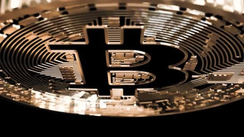 Rotating Golden Bitcoin Coin with Futuristic Circuitry