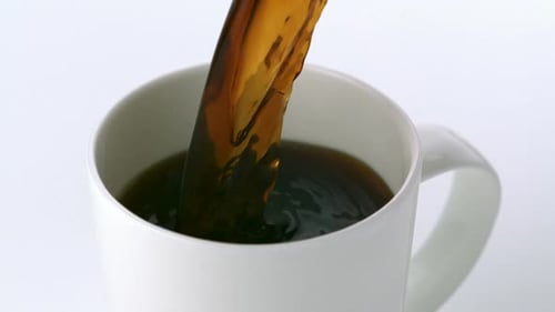 Pouring Fresh Coffee into a Mug