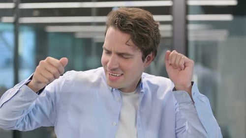 Portrait of Excited Man Dancing Celebrating