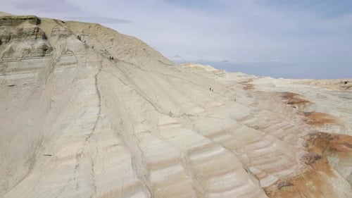 People Hiking in the Desert Mountains Aktau in Kazakhstan