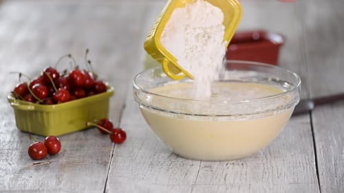 Preparing Cherry Cake Batter at Home on Table