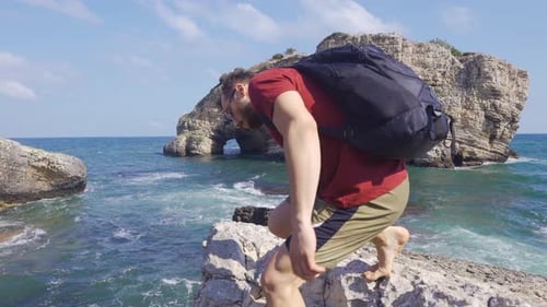 Young man watching the sea.