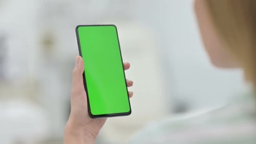 Woman Using Smartphone with Green Key Chroma Screen