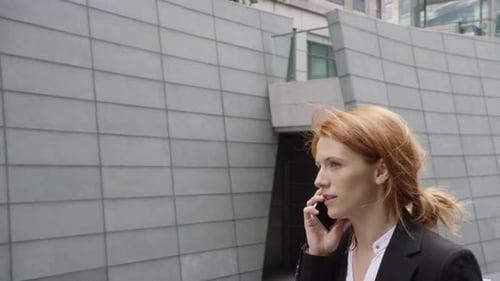 Business Woman Talking on the Phone in the City