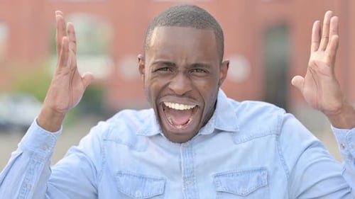 Young Adult Shouting in Frustration