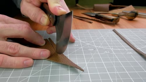 Tanner Cuts Leather Close Up