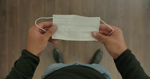 Surgical Face Mask In Hands