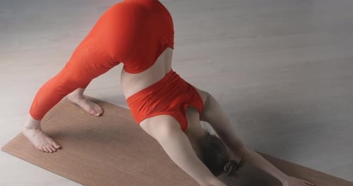 Woman Doing Yoga Poses in a Bright Room