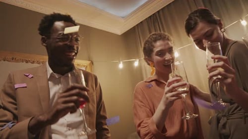 Young Adults Celebrating with Champagne and Confetti