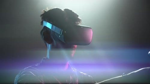 Man Using VR Headset with Controllers