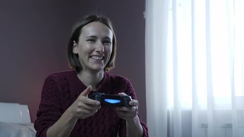 Woman Playing Video Game, Joyful Entertainment at Home