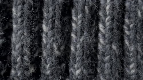 Close-Up of Gray and White Knitted Fabric