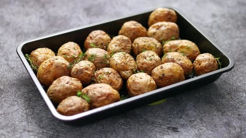 Roasted Potatoes With Herbs in Baking Tray