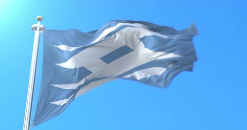 Blue Flag with Stylized White Wave Pattern Waving