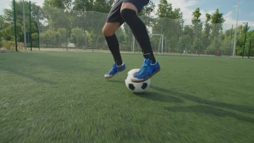 Gros plan des jambes d'un joueur de football