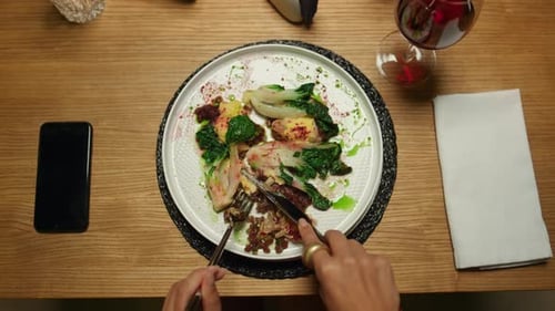 Woman Sharing Dinner Plate with Boyfriend in Restaurant