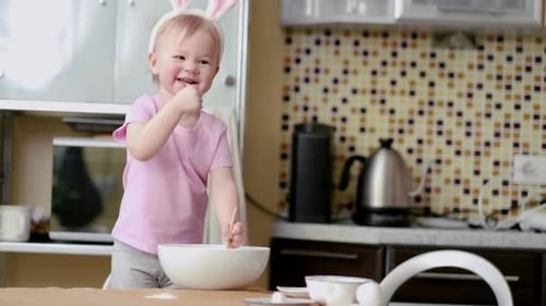 Happy Easter Family Wearing Bunny Ears Headbands in Kitchen and Preparing Baking Cake Easter