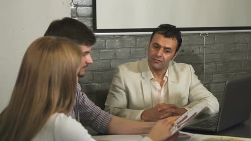 Business Team Discussing Data in Modern Workplace