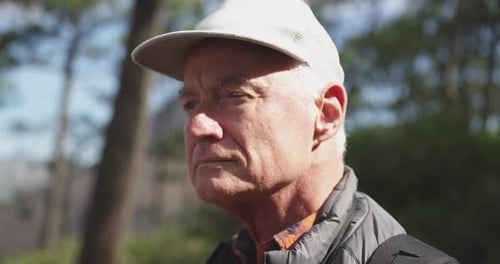 Side view of active senior man in the forest