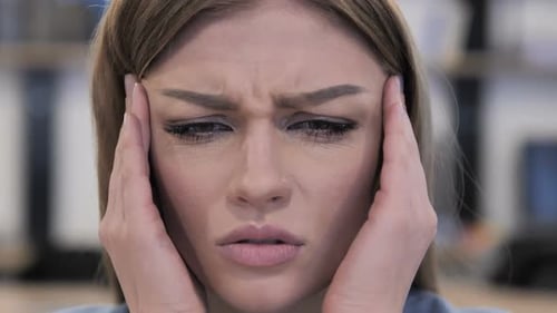 Close Up of Young Girl with Headache
