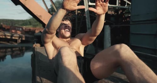 Man Doing Sit Ups Outdoors