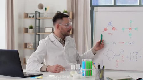 Male Scientist Explaining Chemistry Via Online Lesson