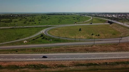 Aerial View of Modern Highway Road Intersection on Rural Landscape