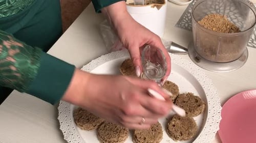 A Woman Makes A Biscuit Cake. Applies Liquid Impregnation To Workpieces. With A Brush. Overall Plan.