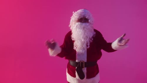 Man in Santa Costume Dancing in Studio