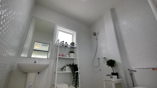 Clean Modern Bathroom Interior with White Tile Design
