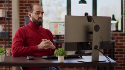 Company Employee Talking to People on Online Videoconference