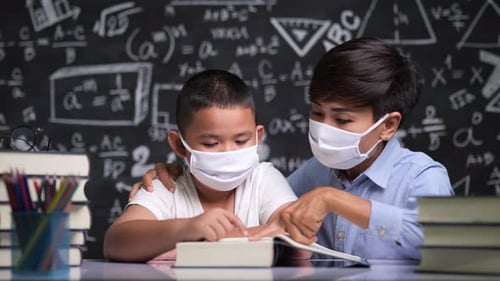 Child and Adult Studying Math Wearing Face Masks