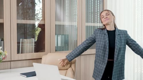 Woman Celebrates With a Dance in Office