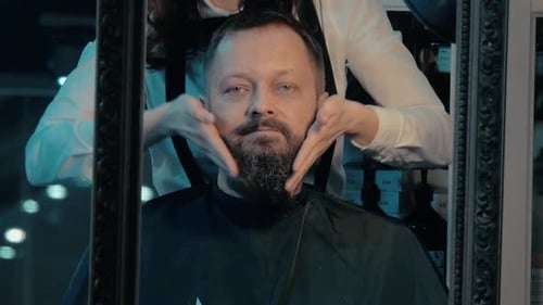 Man Getting Beard Groomed in Barber Shop